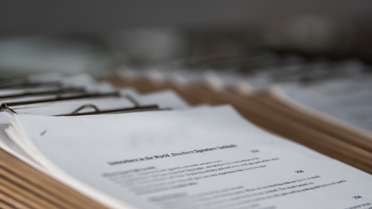 Close-up of a printed analytical report and a pen